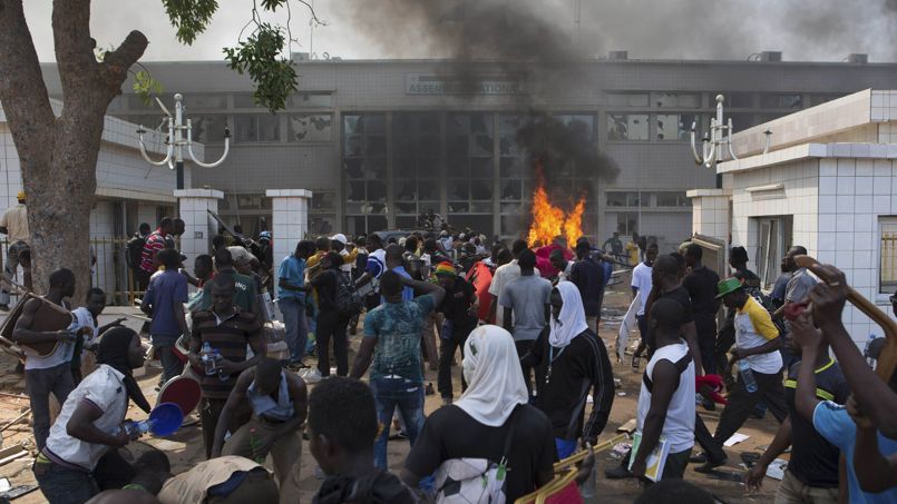 Anti-government protesters set fire to the parliament building in Ouagadougou